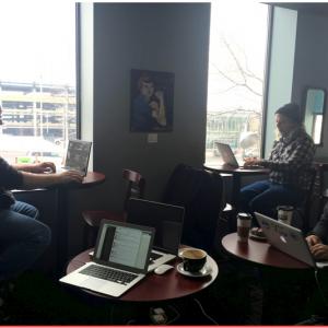 Three guys working at coffee shop